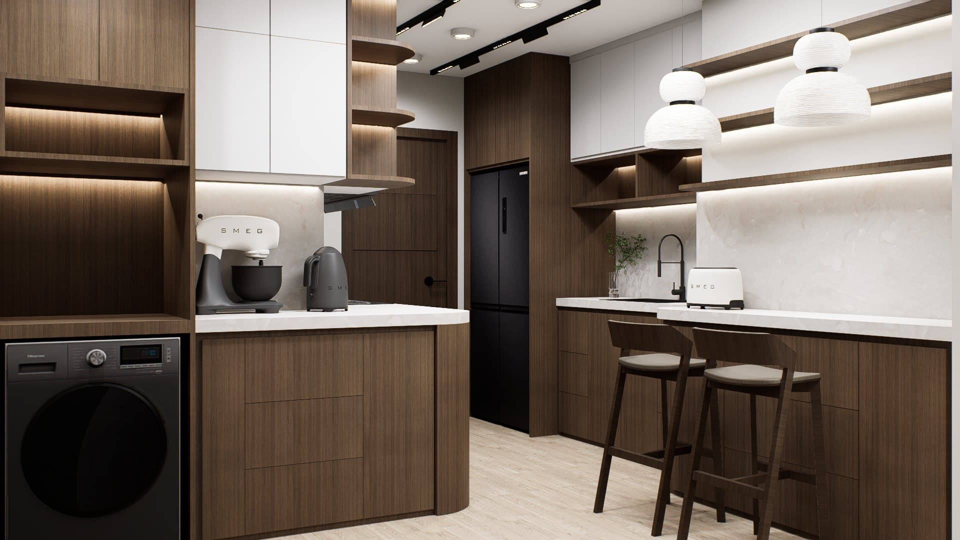 A galley kitchen with quartz counters, concealed tall storage and warm overhead lighting.