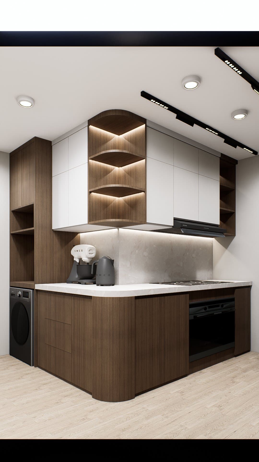 A galley kitchen with quartz counters, concealed tall storage and warm overhead lighting.
