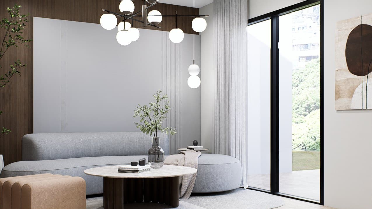 A living room framed by a feature wall and curved seating, with soft cove lighting overhead.