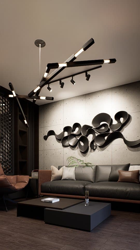 A living room arranged around a sectional sofa and feature TV wall, with cove lighting and tonal styling.