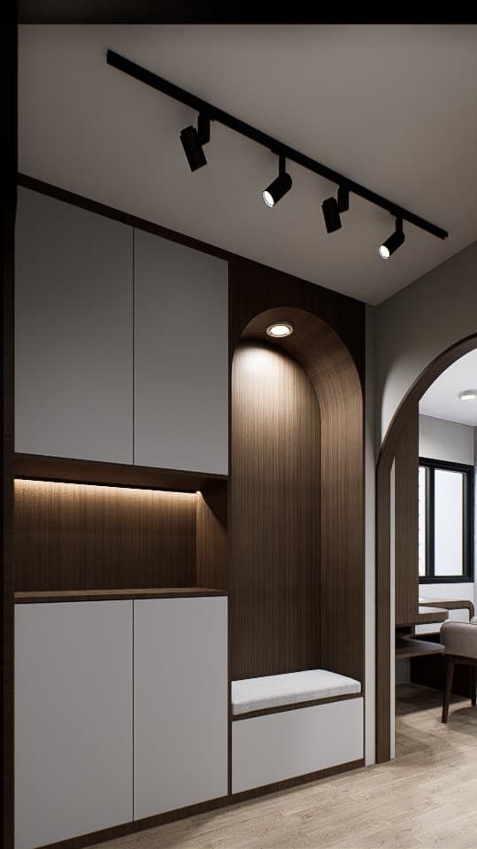 A walk-in closet lined in oak veneer, with full-height wardrobe doors and a recessed dressing console.