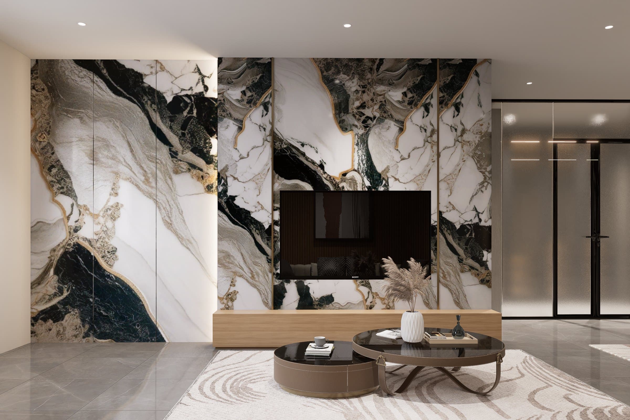 A living room framed by a feature wall and curved seating, with soft cove lighting overhead.