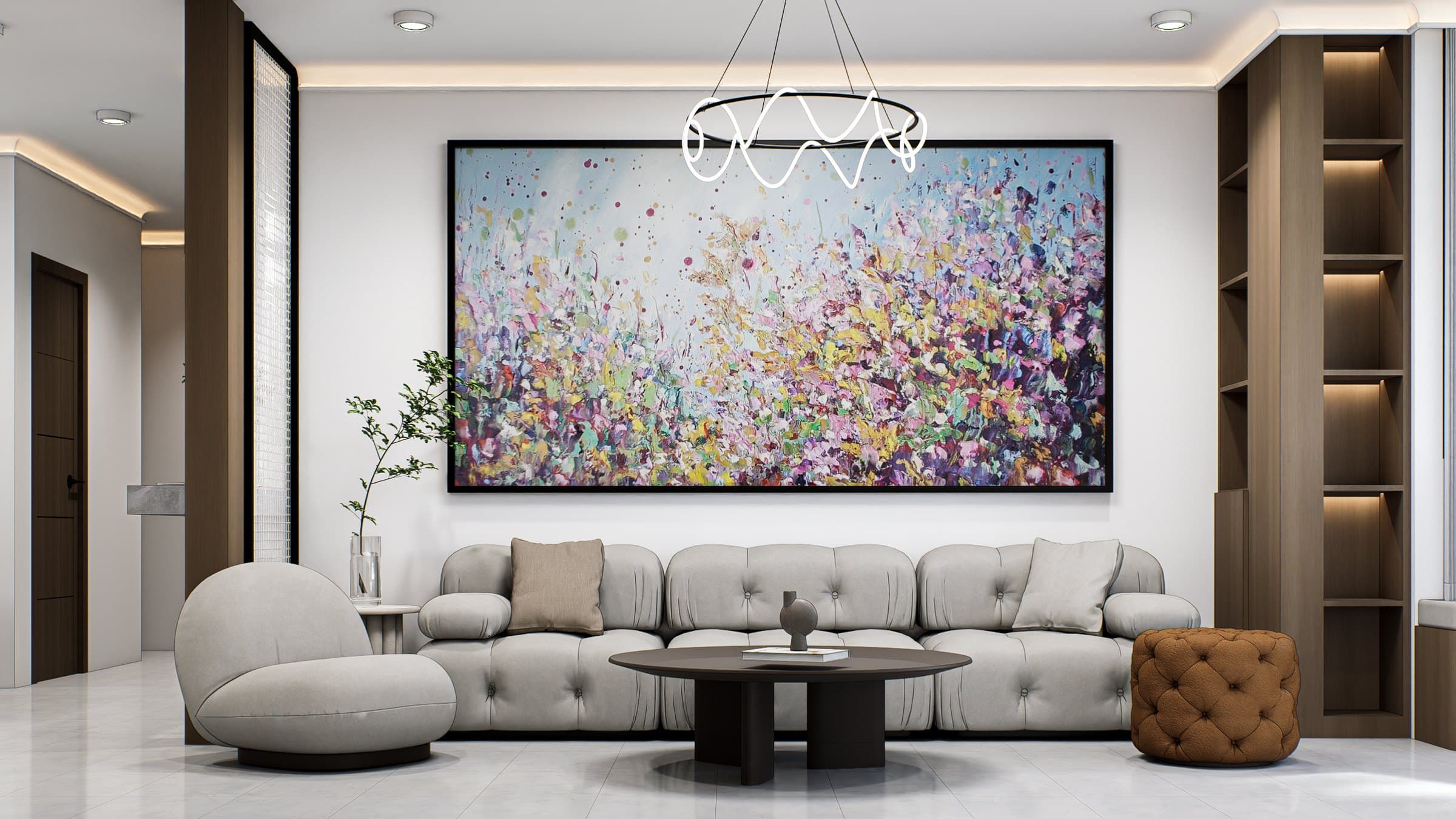 A living room framed by a feature wall and curved seating, with soft cove lighting overhead.
