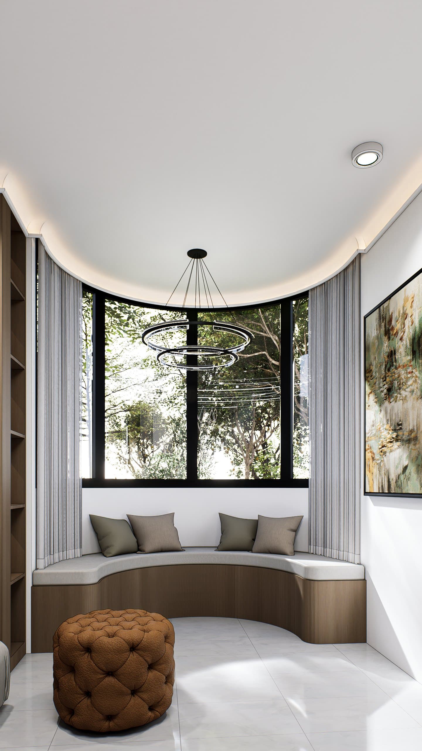 A living room framed by a feature wall and curved seating, with soft cove lighting overhead.