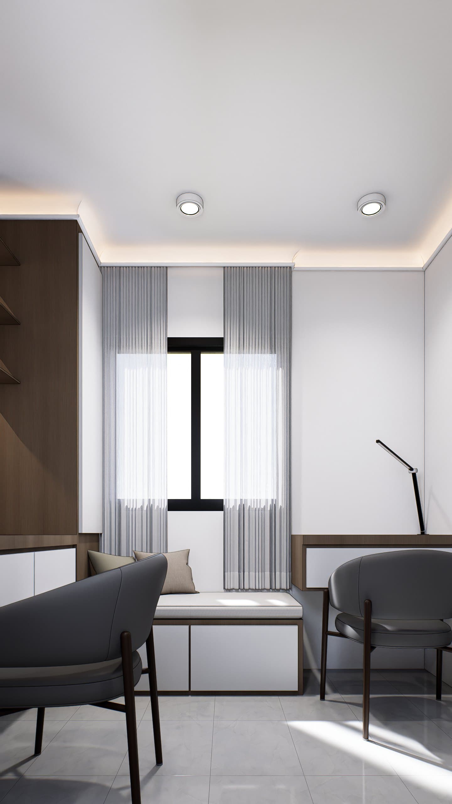 A study setting with a built-in oak desk, brass-arm lamp and tonal wall panelling.