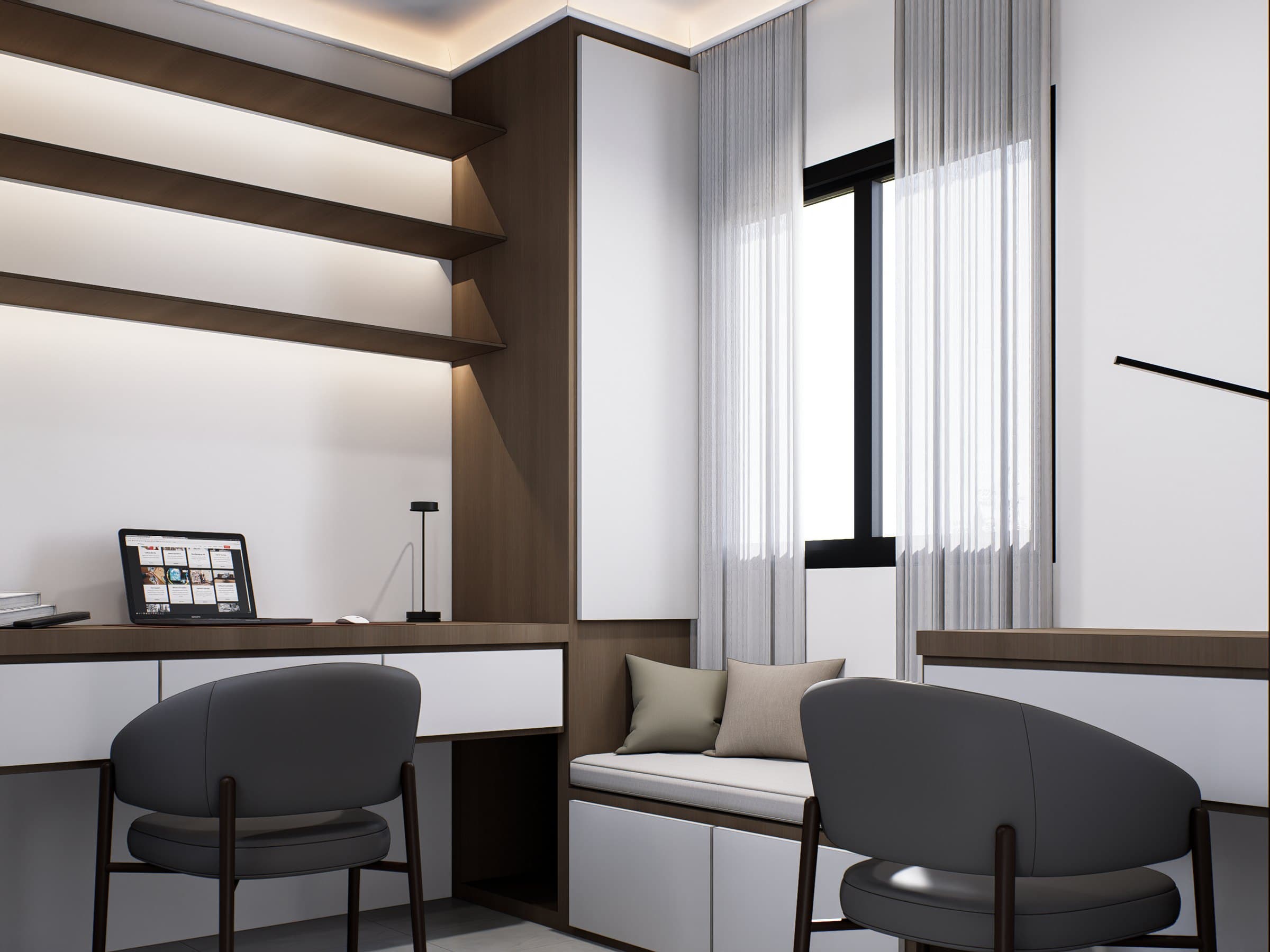 A study setting with a built-in oak desk, brass-arm lamp and tonal wall panelling.