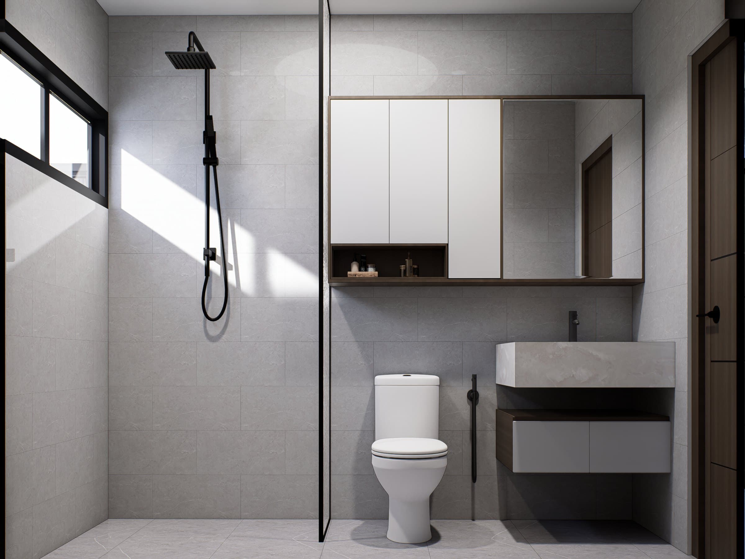 A bathroom in tonal tile, finished with a wall-hung vanity, glass shower screen and warm overhead lighting.