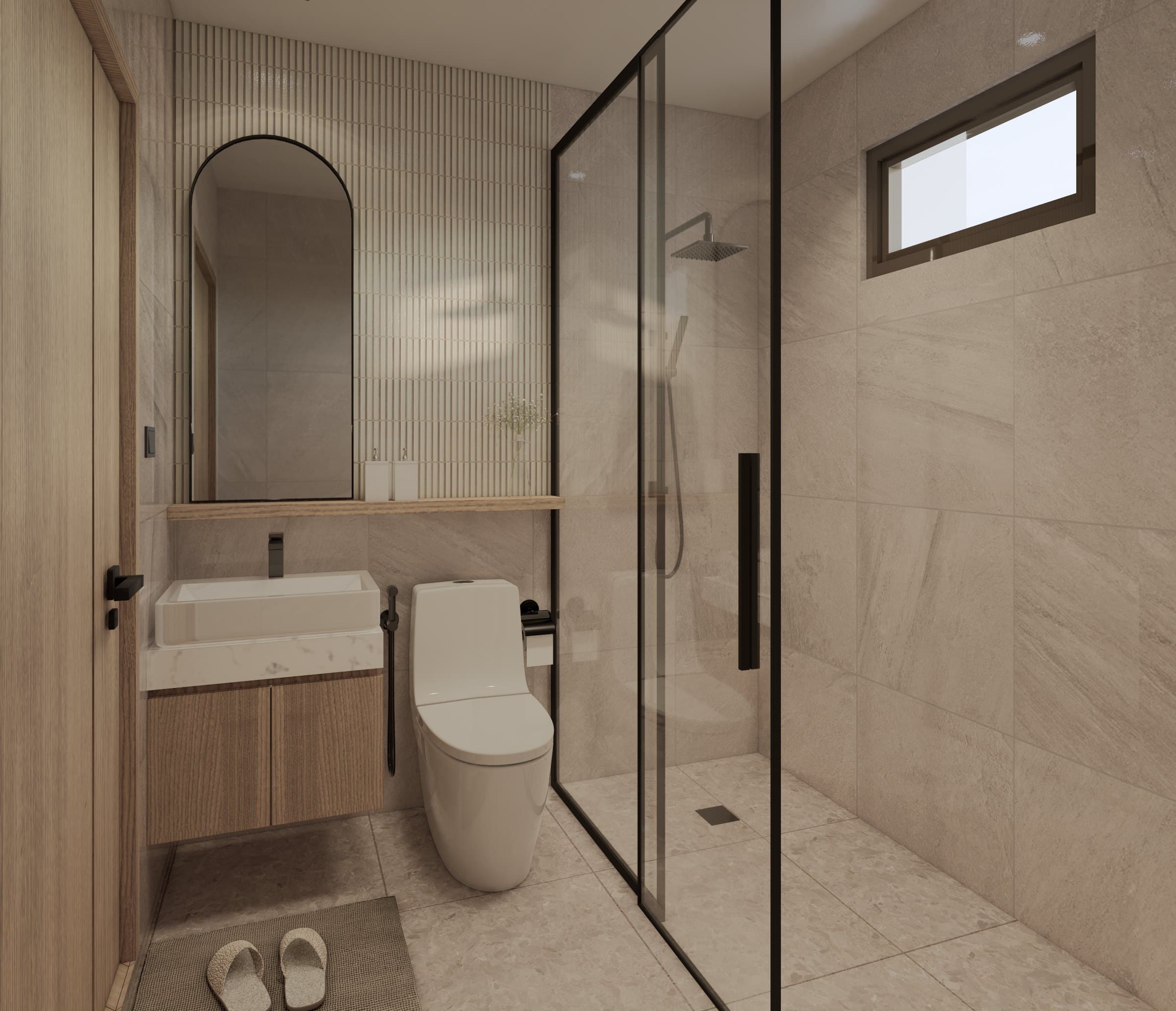 A bathroom in tonal tile, finished with a wall-hung vanity, glass shower screen and warm overhead lighting.