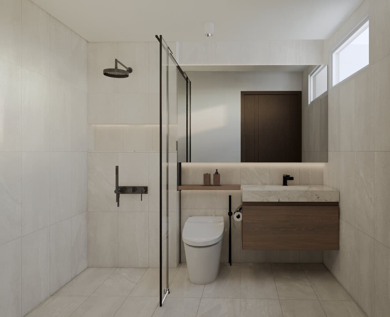 A common bathroom in tonal tile, with a wall-mounted vanity, glass shower screen and warm pendant lighting.