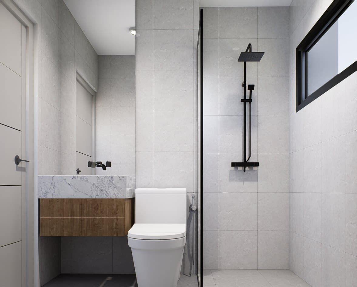 A common bathroom in tonal tile, with a wall-mounted vanity, glass shower screen and warm pendant lighting.