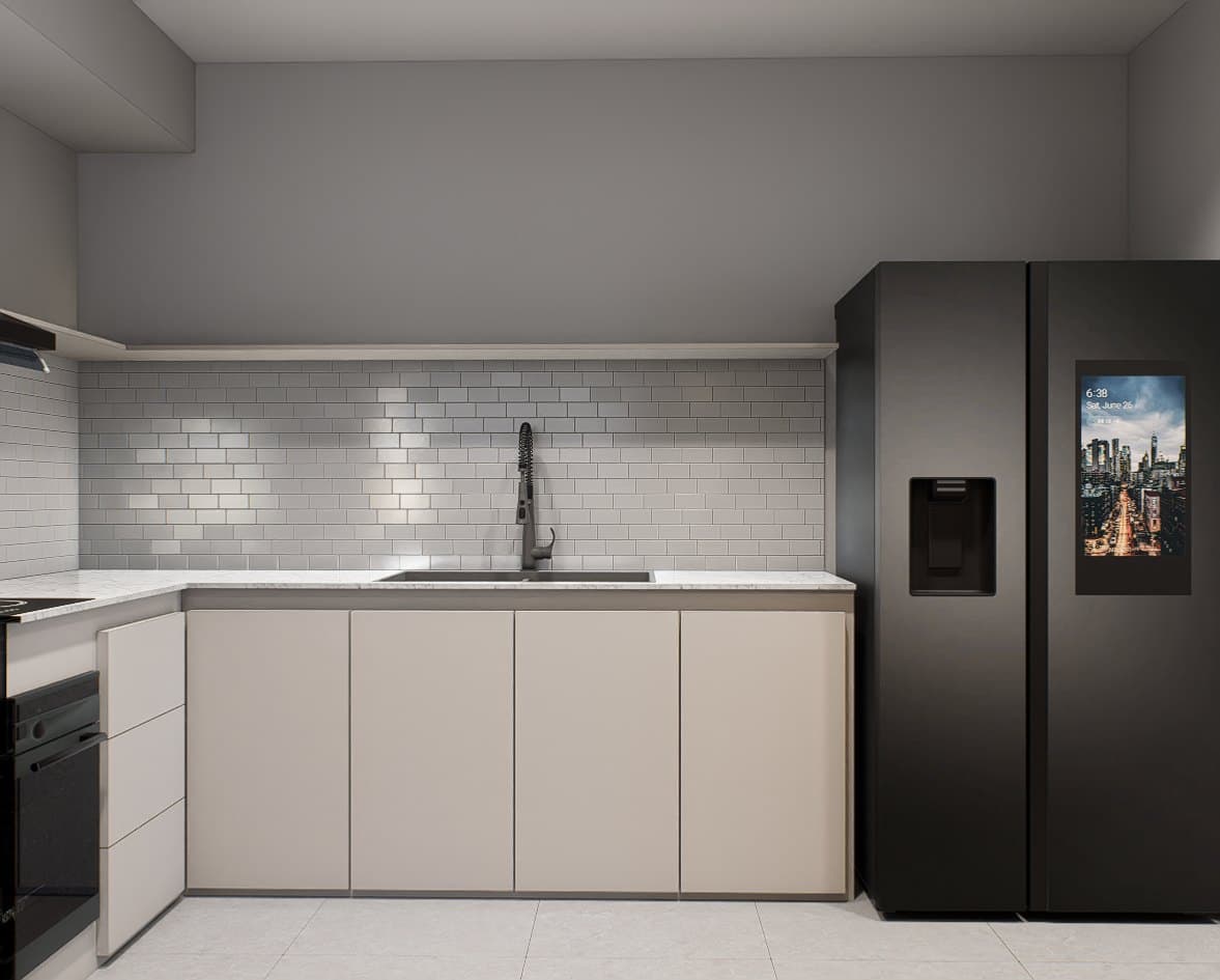 A galley kitchen with quartz counters, concealed tall storage and warm overhead lighting.