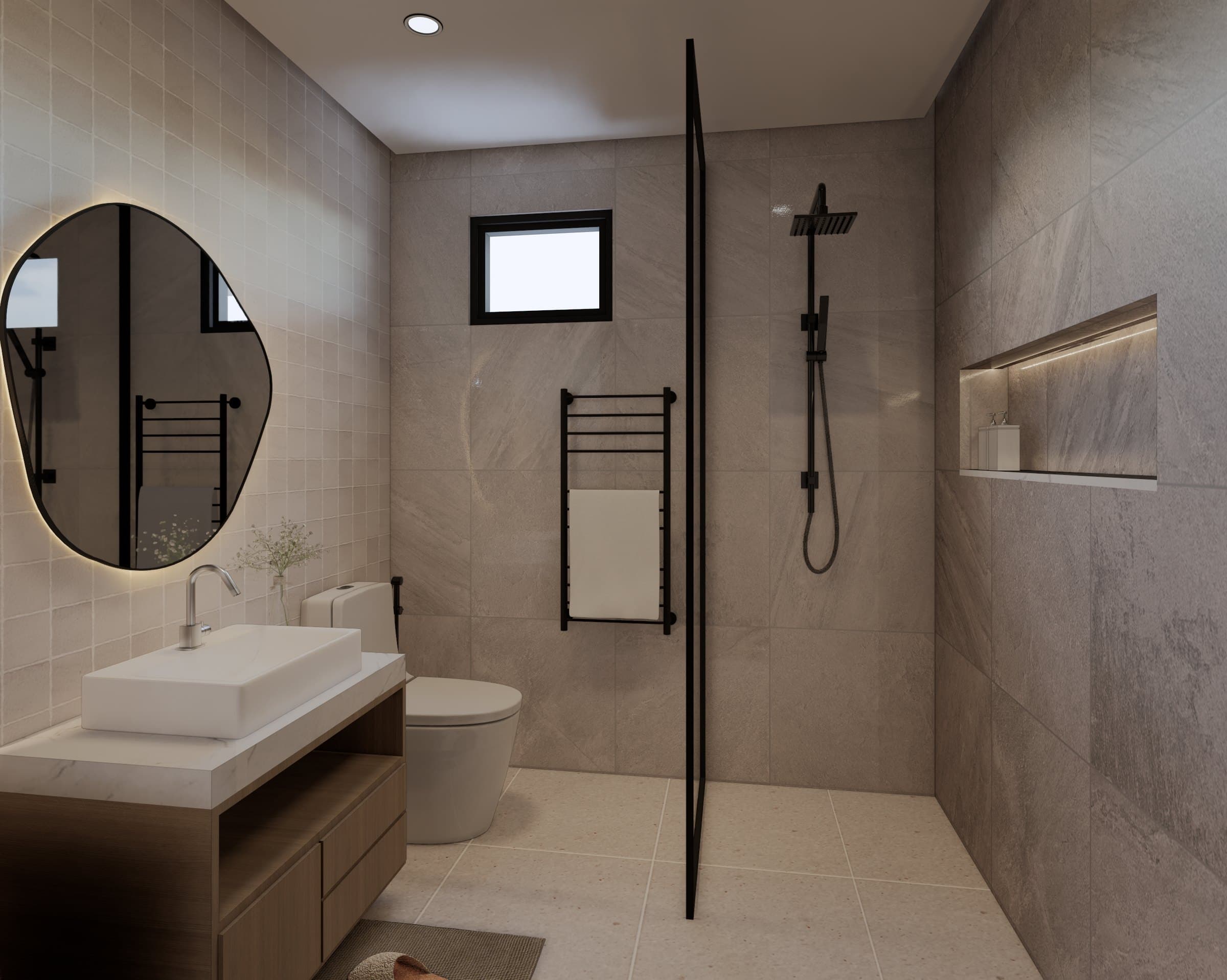 A common bathroom in tonal tile, with a wall-mounted vanity, glass shower screen and warm pendant lighting.