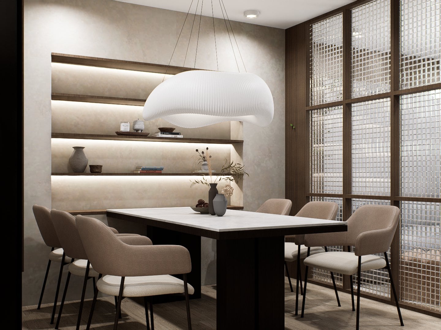 A dining setting under a sculptural pendant, anchored by an oak table and tonal seating.