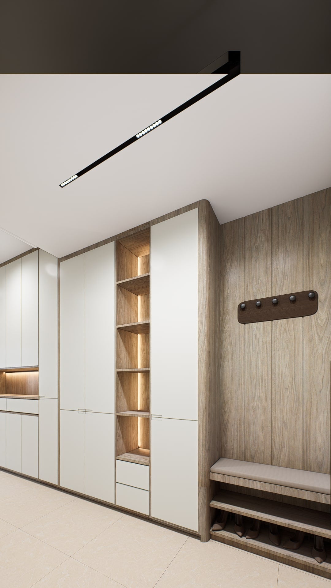 A foyer lined with full-height shoe cabinetry, a slatted timber wall and a cushioned bench, with warm light in the open oak niches.